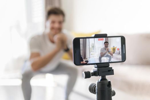 personal trainer recording exercises home. Resolution and high quality beautiful photo