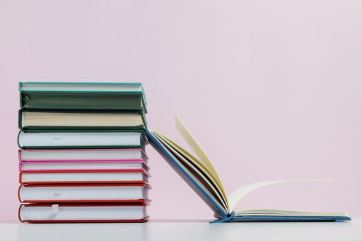 colorful books with pink background arrangement. Resolution and high quality beautiful photo
