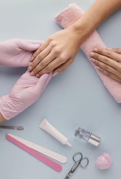 close up manicurist holding customer hand. Resolution and high quality beautiful photo