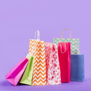 colorful empty shopping bags purple background. Resolution and high quality beautiful photo