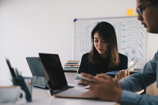 Business team working together and training to analyze technical price graph and indicator. Chart and stock trading computer screen