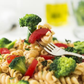 close up fork with broccoli tomato fusilli. Resolution and high quality beautiful photo
