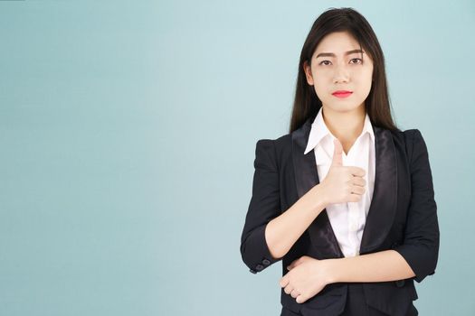 Asian business women in suit and thump up hand sign