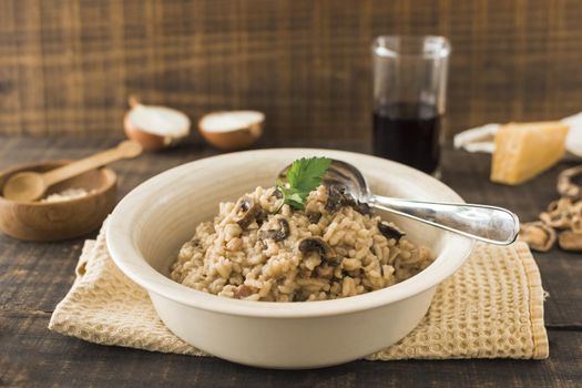 close up mushroom risotto white bowl with spoon napkin table. Resolution and high quality beautiful photo