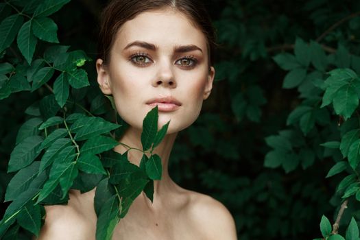 smiling woman Cosmetology nature green leaves glamor Lifestyle. High quality photo