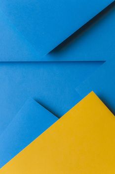 creative arrangement yellow blue colored paper creating abstract background. Resolution and high quality beautiful photo