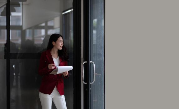 Cropped shot of young asian woman pencil while working for financial in office.