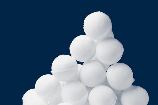 snowballs heap on dark blue background