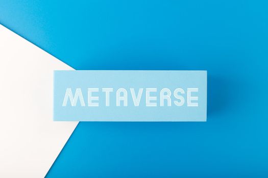 Metaverse modern minimal concept in blue colors. Written metaverse single word on blue rectangle against blue background. Future technologies.