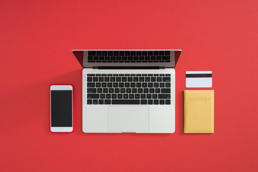 Flat lay work concept with computer laptop and travel accessories on table while a trip travel in holidays