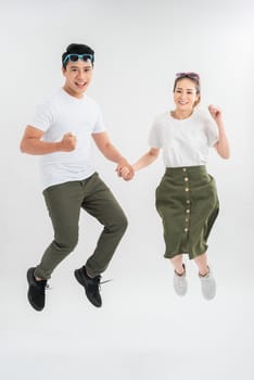 Glad girl having fun with boyfriend. Studio shot of couple fooling around in valentine's day.