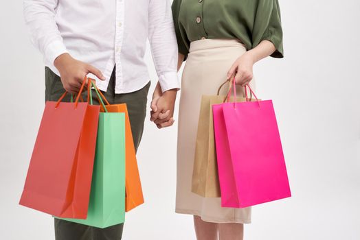 Woman and man holding shopping bags with copy space