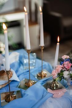 atmospheric candle decor with live fire on the banquet table