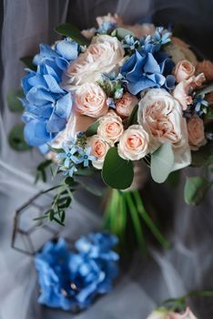 elegant wedding bouquet of fresh natural flowers and greenery