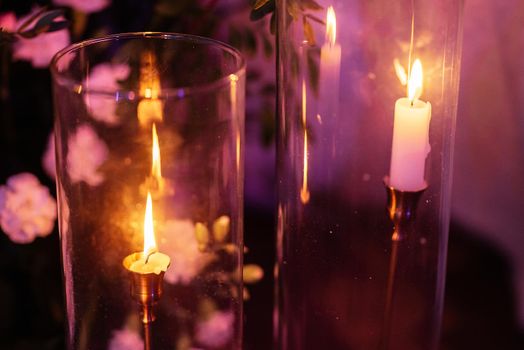 atmospheric candle decor with live fire on the banquet table