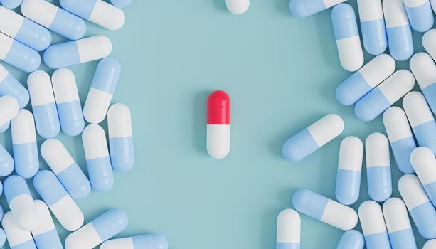 Capsule pills on blue background, healthcare medical concept, antibiotics and cure, 3d render