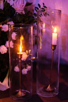 atmospheric candle decor with live fire on the banquet table