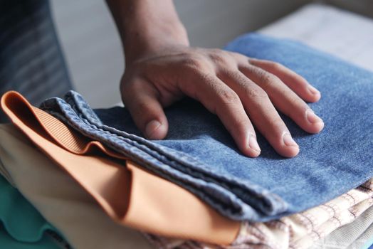 close up of stack of clothes on table