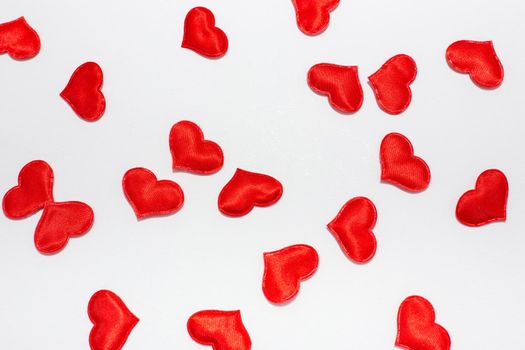 red valentine hearts on a white background
