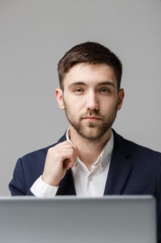 Business Concept - Portrait handsome stressful business man in suit shock looking in front of laptop at work office. White Background