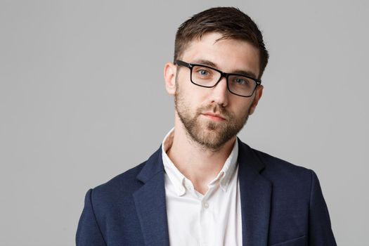 Business Concept - portrait young successful businessman posing over dark background. Copy space.