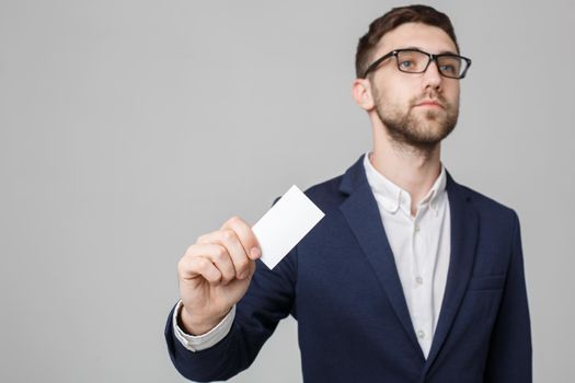 Business Concept - Portrait Handsome Business man showing name card with smiling confident face. White Background.Copy Space.