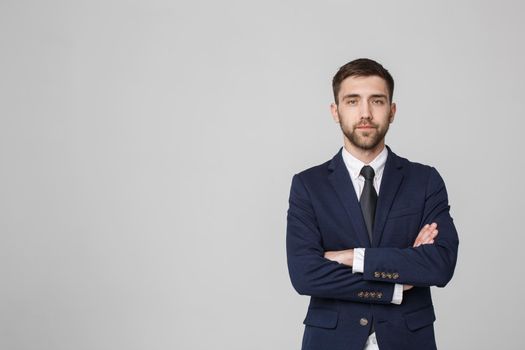 Young successful businessman posing over dark background. Isolated White Background. Copy space.