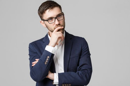 Business Concept - portrait young successful businessman posing over dark background. Copy space.