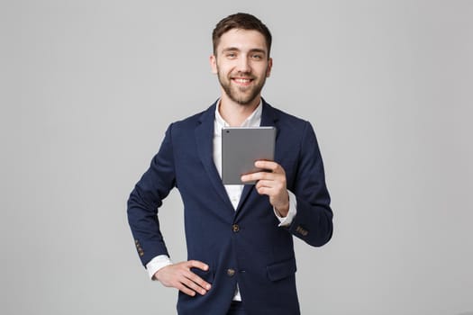 Business Concept - Portrait Handsome Business man playing digital tablet with smiling confident face. White Background. Copy Space.