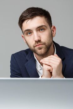 Business Concept - Portrait handsome stressful business man in suit shock looking in front of laptop at work office. White Background