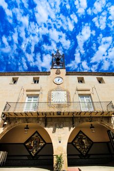 Novelda, Alicante, Spain- September 18, 2021: Beautiful Novelda Town Hall facade under Altocumulus Floccus clouds in summer