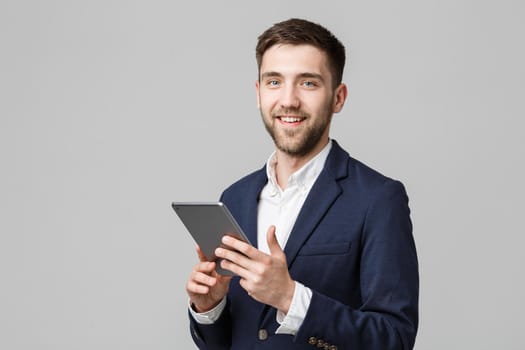 Business Concept - Portrait Handsome Business man playing digital tablet with smiling confident face. White Background. Copy Space.