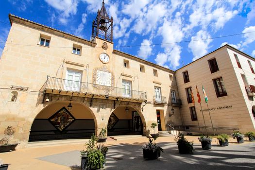 Novelda, Alicante, Spain- September 18, 2021: Beautiful Novelda Town Hall facade under Altocumulus Floccus clouds in summer