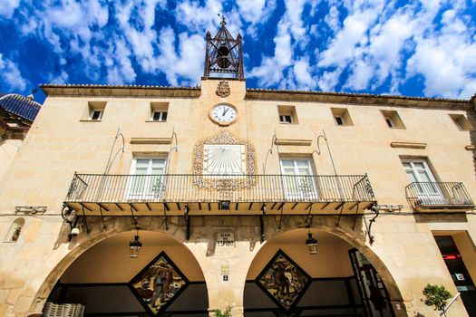 Novelda, Alicante, Spain- September 18, 2021: Beautiful Novelda Town Hall facade under Altocumulus Floccus clouds in summer