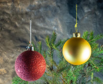 red and gold Christmas balls on the background of fir branches. Christmas decoration
