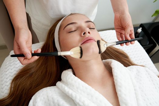 Face Skin Care. Woman Gets Brushes Treatment At Beauty Clinic