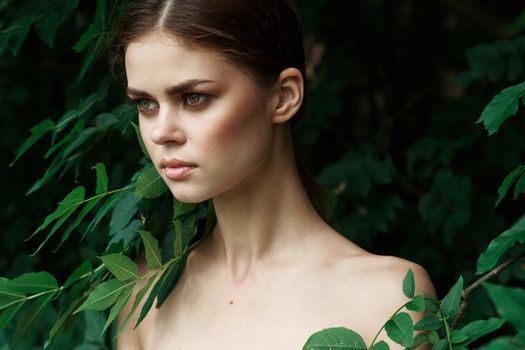 beautiful woman green leaves clean skin nature summer model. High quality photo