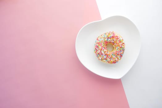 chocolate donuts on plate with copy space.