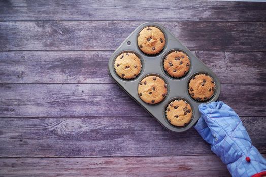 muffin and baking tray on table