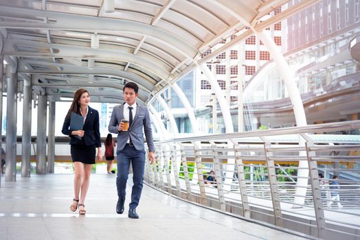 Businessman and his secretary walking and talking together, Business concept, Relationship concept, Teamwork concept