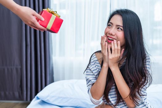 Asian woman surprised by the birthday gifts. People and lifestyles concept. Valentine and Birthday theme. Wedding and engagement theme. Happiness emotion