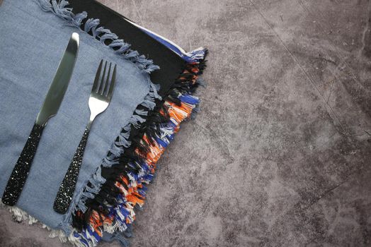 table napkin with knife and fork on table