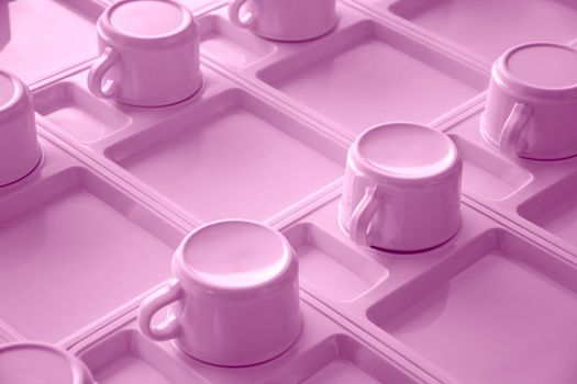 Pink cups in a row. Object and utensil concept. Coffee time theme.