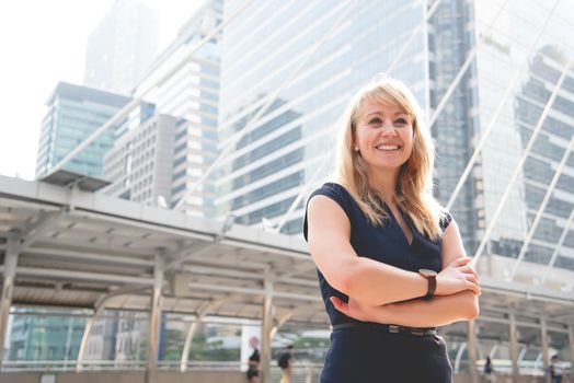 Portrait of happy business woman looking confident. People and lifestyles concept. Outdoors theme.