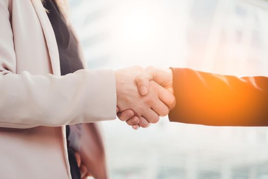 Business people hand shake for dealing with new project. Business and People concept. Contact agreement and job application theme. City and urban theme.