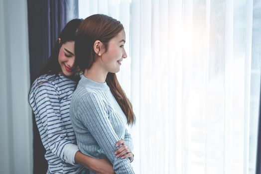 Two Asian Lesbian women hug and embracing together in bedroom.Beauty concept. Happy lifestyles theme. Homosexual life theme. Love scene making of female