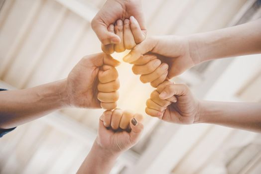 Fist Bump of friendship and teamwork for startup new project. Business and togetherness concept. Cooperation and Successful concept. People and hands theme. Warm tone filter