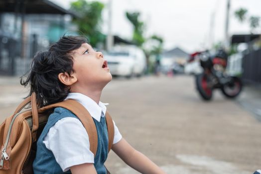 Little boy boring to go to school in morning. Kids students having boredom in depress emotion. People and Lifestyles concept. Education and Back to school theme. Children development theme. 