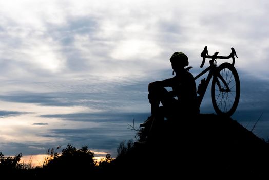 Silhouette Bicycle cycling man on the hill. Relax and sport concept