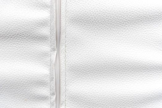 White leather with zip background. Wallpaper and Texture concept. Close up of material theme.